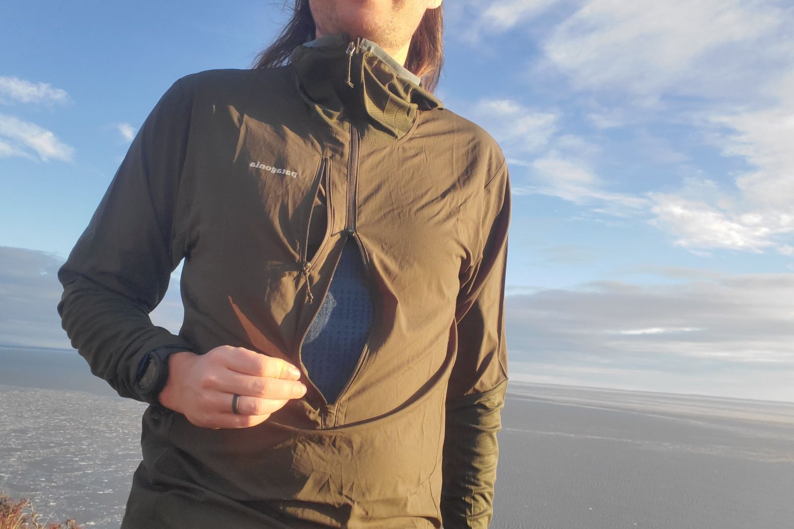 A closeup of the chest zipper on a windbreaker.