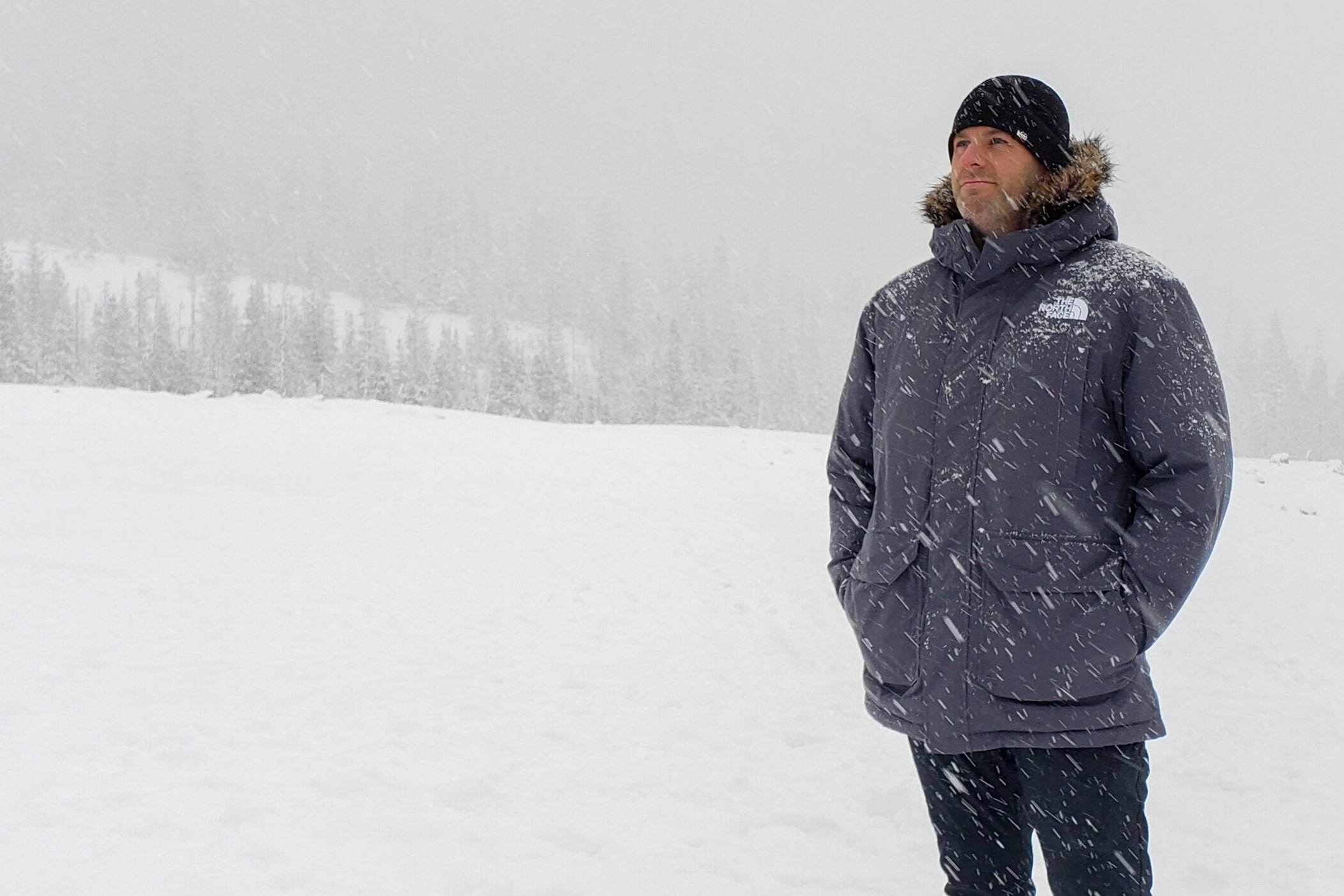 A-man-wearing-the-North-Face-McMurdo-Park-in-the-driving-snow