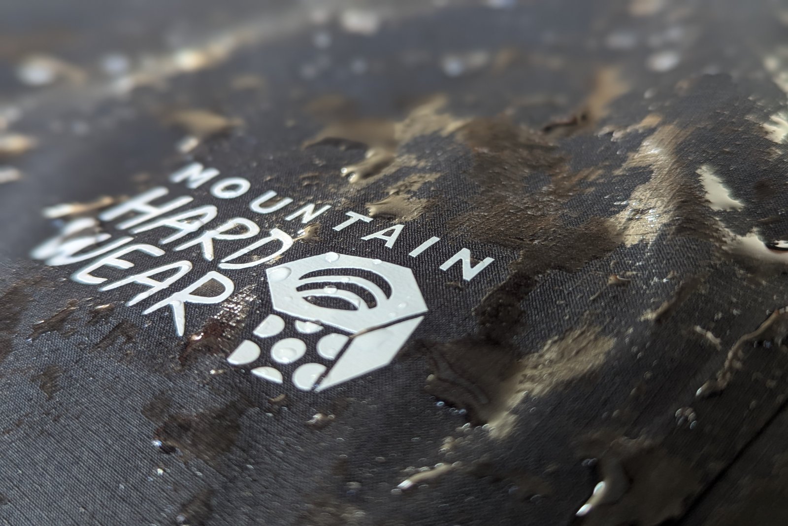 Close-up of the Mountain Hardware Stretch Ozonic with water on the fabric.
